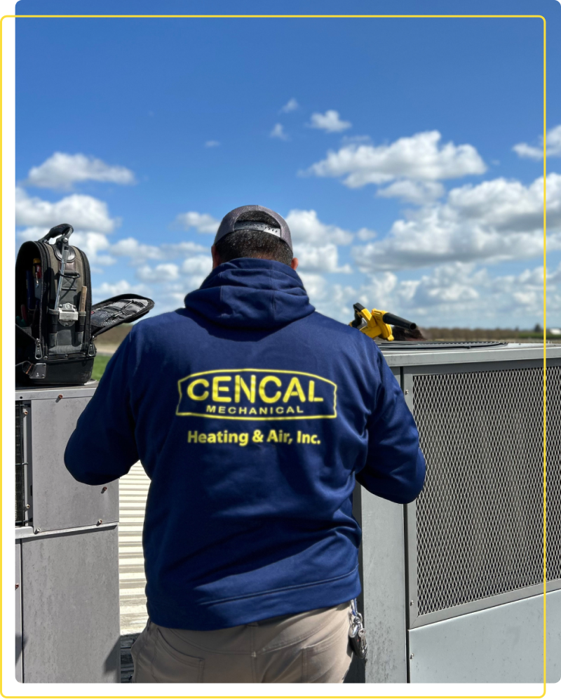 Technician working on commercial ac unit
